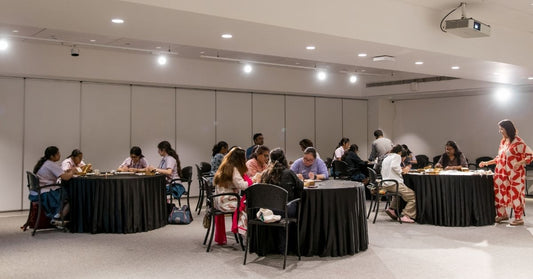 Participants at Miharu’s Dhokra Experience Workshop at Kolkata Centre for Creativity, engaging in hands-on wax modeling and jewelry making.