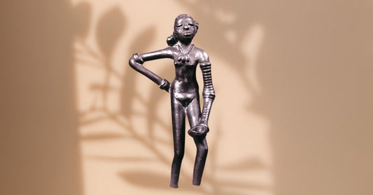 Bronze Dhokra figurine inspired by the iconic Dancing Girl of Mohenjo-daro, representing India’s 4,000-year-old lost-wax metal casting tradition.