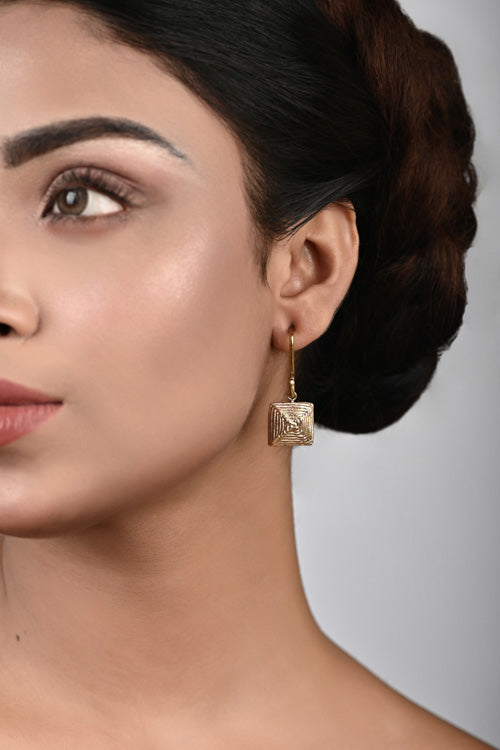 women wearing square earring