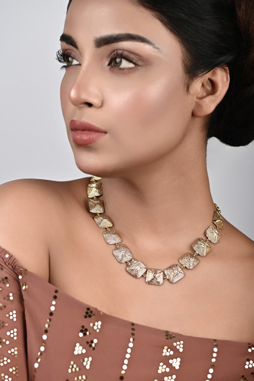 Women wearing brass necklace