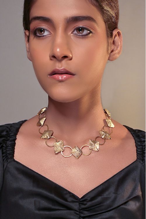 Women wearing choker brass necklace