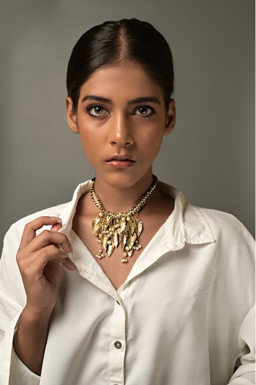 Women wearing choker brass necklace