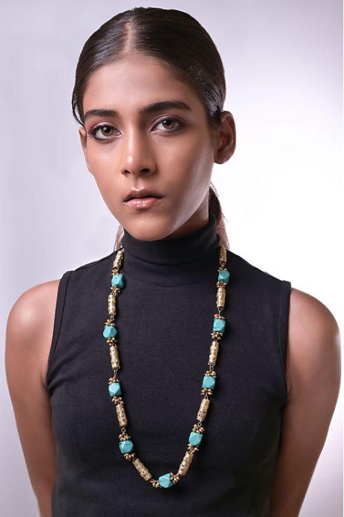 Women wearing brass necklace with semi precious stones