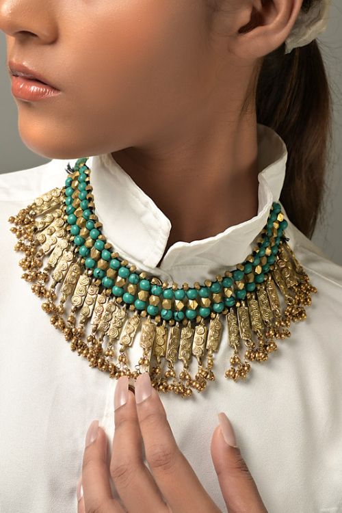 Women wearing choker dokra necklace with semi precious stones