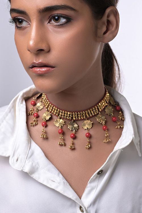 Women wearing handmade brass jewellery with semi precious stones