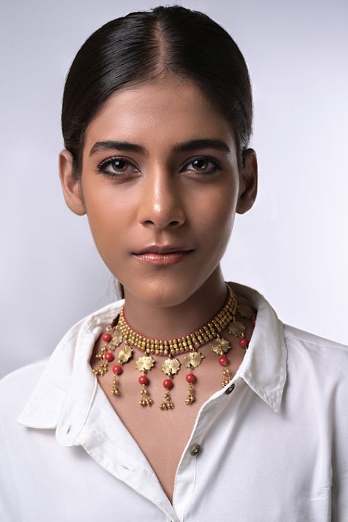 Women wearing handmade dhokra jewellery with semi precious stones