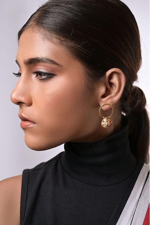 Women wearing dokra earrings