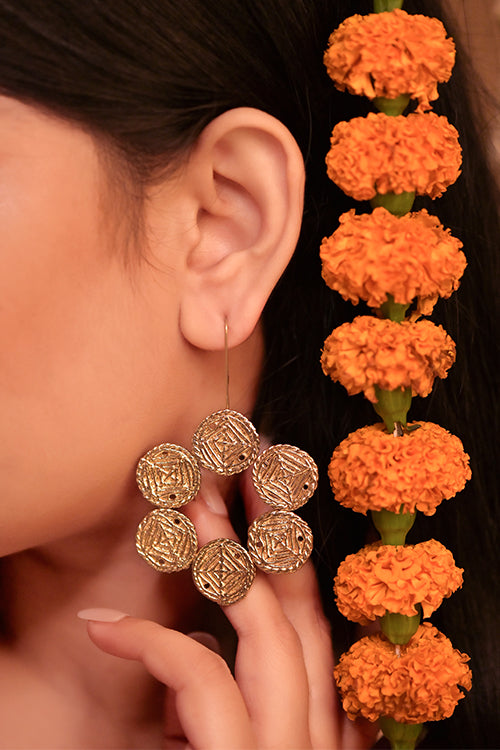women wearing dokra earring