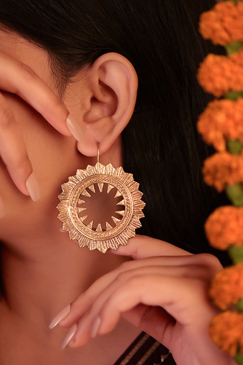 women wearing sundial circular brass earring