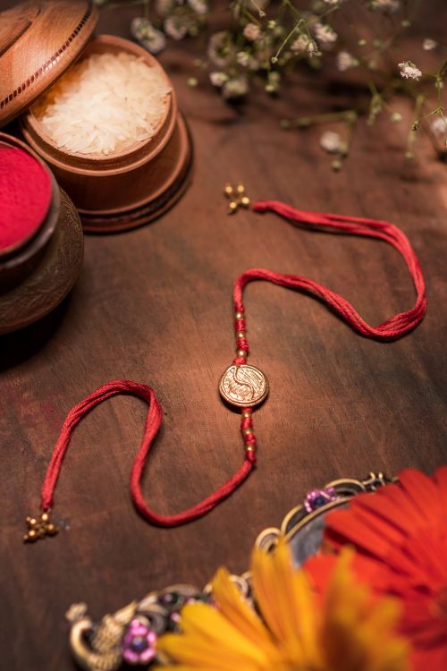 Miharu Handmade Light Red Dokra Rakhi